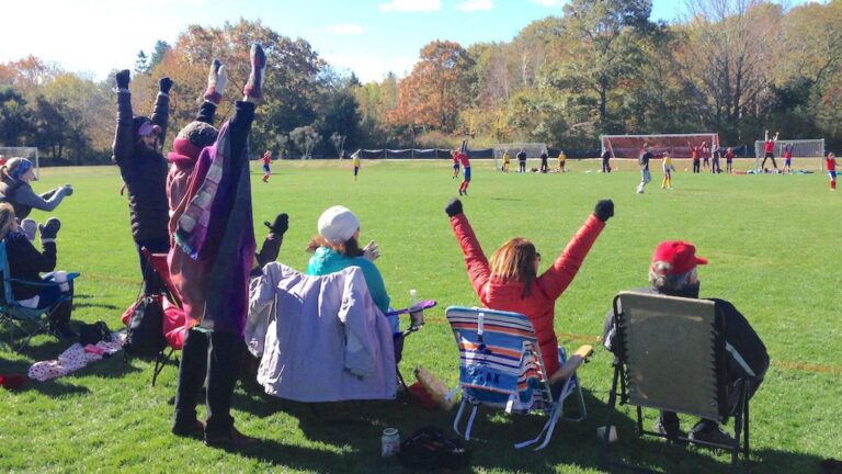 Parents watching soccer